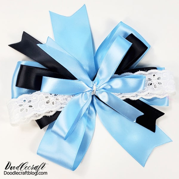 Wrap all the bows together through the center with a piece of sturdy thread.