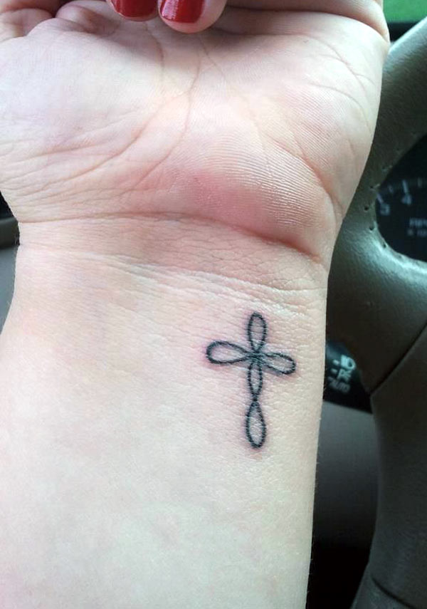 This small and cute cross tattoo is simple design ideas for a girl