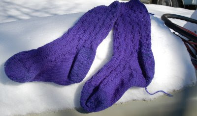 Completed socks in the snow