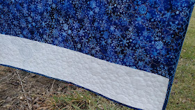 Modern snowflake quilt using Island Batik Alpine Ice fabrics