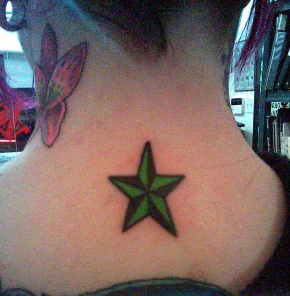 Beautiful sparkling stars and flower tattoo on female body side