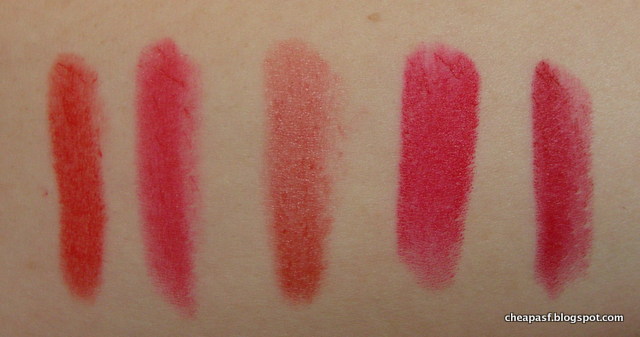 Swatches from left to right: Revlon ColorBurst Matte Balm in Striking, Be a Bombshell Lip Crayon in Hot Damn,  Revlon Just Bitten Kissable Balm Stain in Romantic, Wet N Wild Megalast Lipstick in Red Velvet,  NYX Matte Lipstick in Perfect Red