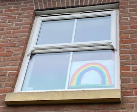 Rainbow in the window for coronavirus lockdown