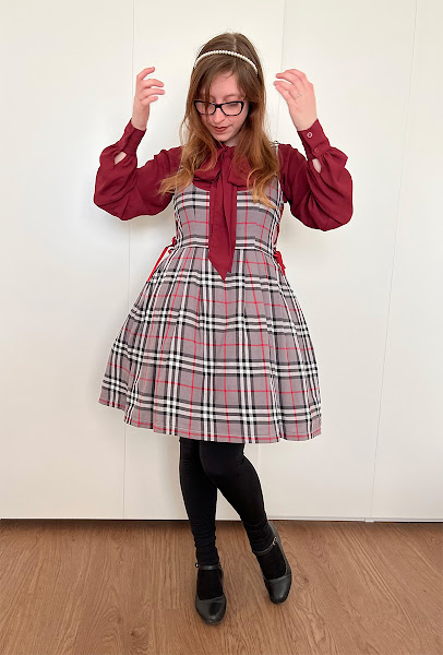 lolita fashion outfit with grey tartan dress with bordeaux shirt and black tights and shoes