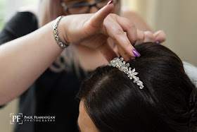 hairdresser putting tiara in hair 