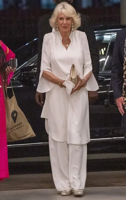 Duchess of Cornwall wore a royal blue lace gown, and a printed shirt dress. Jeannette Kagame, Carrie Johnson and Justin Trudeau