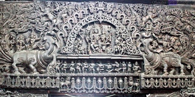 Intricately carved Makara toranas on the exterior of the Garbhagriha