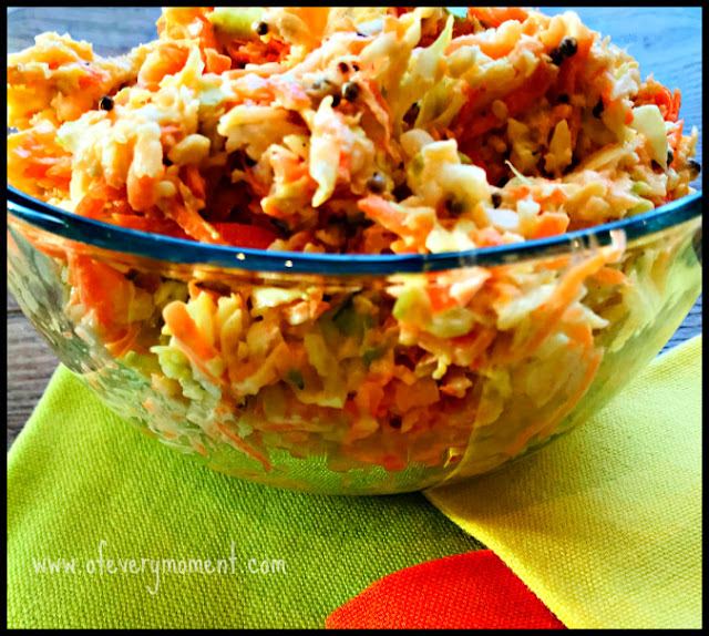 Bowl of coleslaw resting on tri-colored napkins