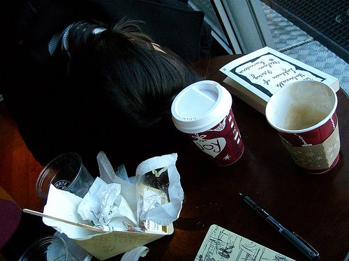 My sister Natasha catching some sleep in Schiphol's Starbucks.