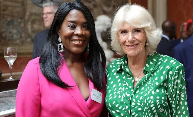 Queen Camilla wore a green Audrey drapery dota dress by Samantha Sung. Colonel Ruth Weir. Bee Garden Party at Marlborough House