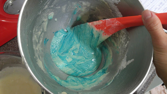 Macaron batter being mixed.