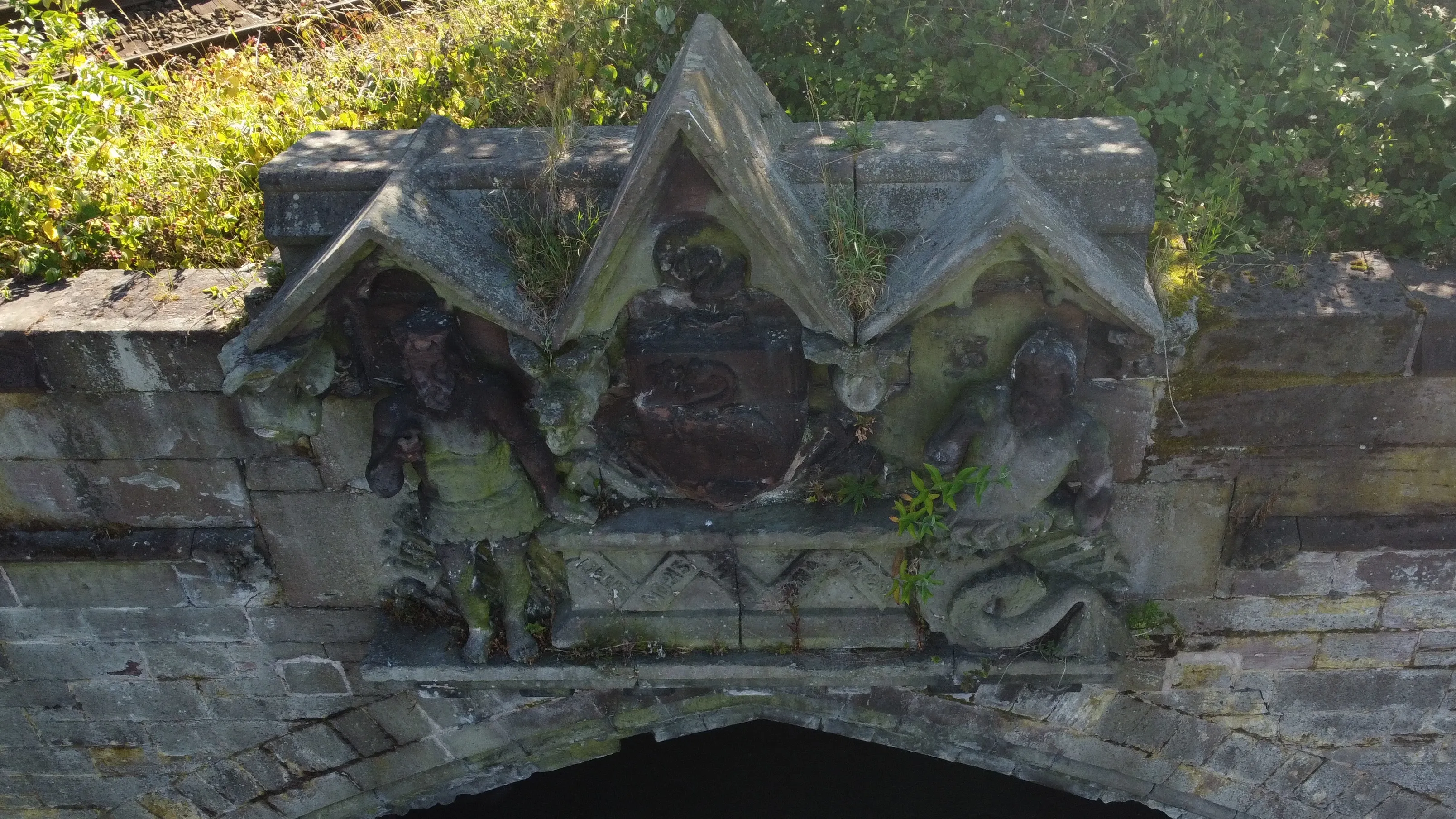 Stone figures above cemetery entrance at Cherry Lane Liverpool