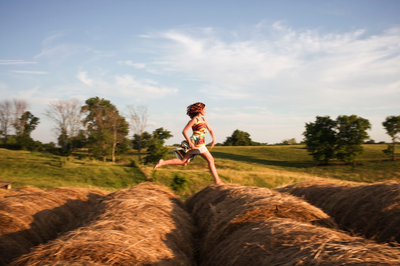 Amy West Running on Hay Bales