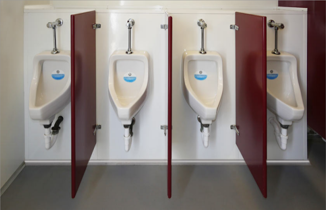 Four porcelain urinals