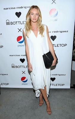 Candice Swanepoel beauty leg in a loose-fitting white dress