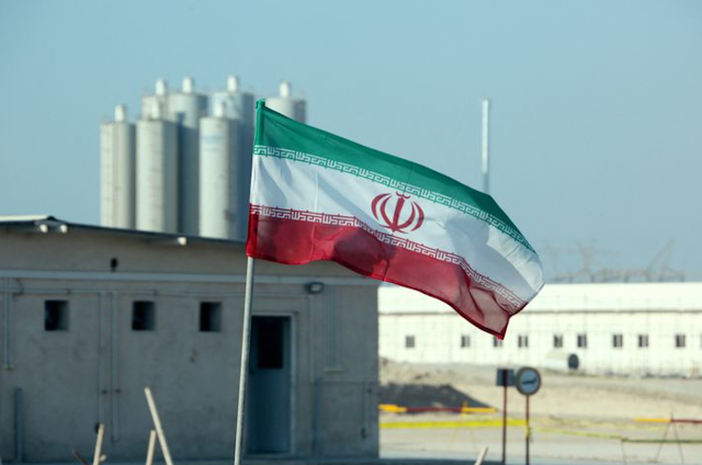 "This photo was taken on November 10, 2019, showing the flag of Iran at the Bushehr Nuclear Power Plant in Iran during an official ceremony to initiate work on the second reactor at the facility. (AFP/ATTA KENARE)"