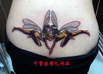 sexy girl with 2 fairy tattoo on lower back tattoo picture