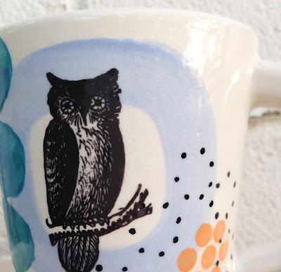 detail of owl on ceramic mug