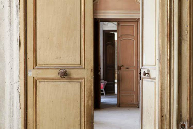 Close up detail of antique wood doors in French Chateau de Gudanes