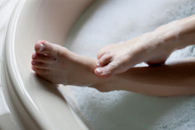 female feet in bathtub