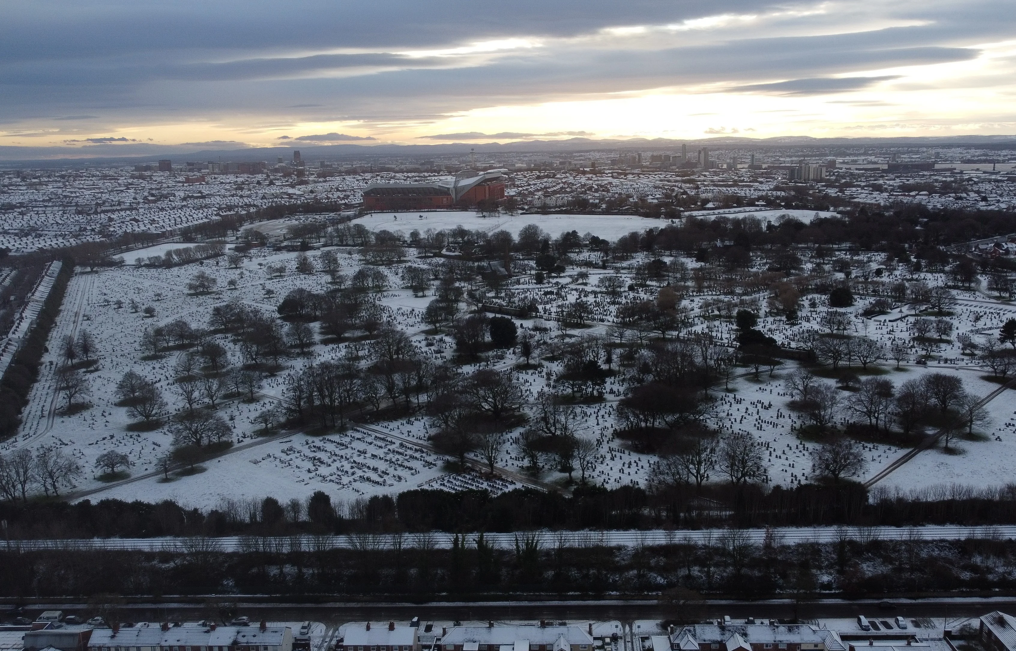 Drone photo of snow covering Anfield Cemetery, Stanley Park and Liverpool Stadium