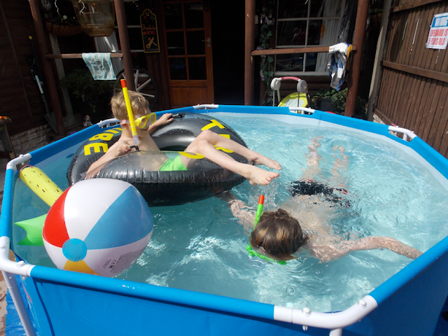 playing with snorkels and floats in the pool