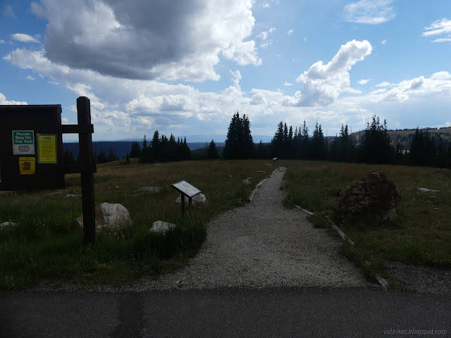 52: gravel trail with signs along it