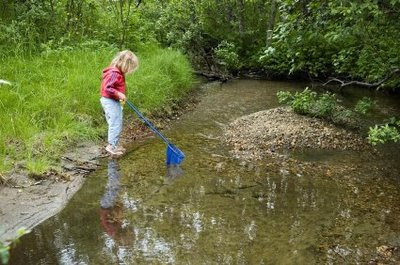 NAMC montessori child getting back to nature girl pond