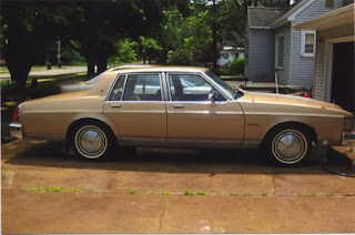 Tan Oldsmobile, side view