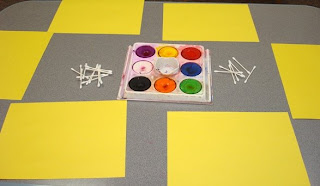 Tempera Cakes in Tray, Q-tips, and Yellow Paper