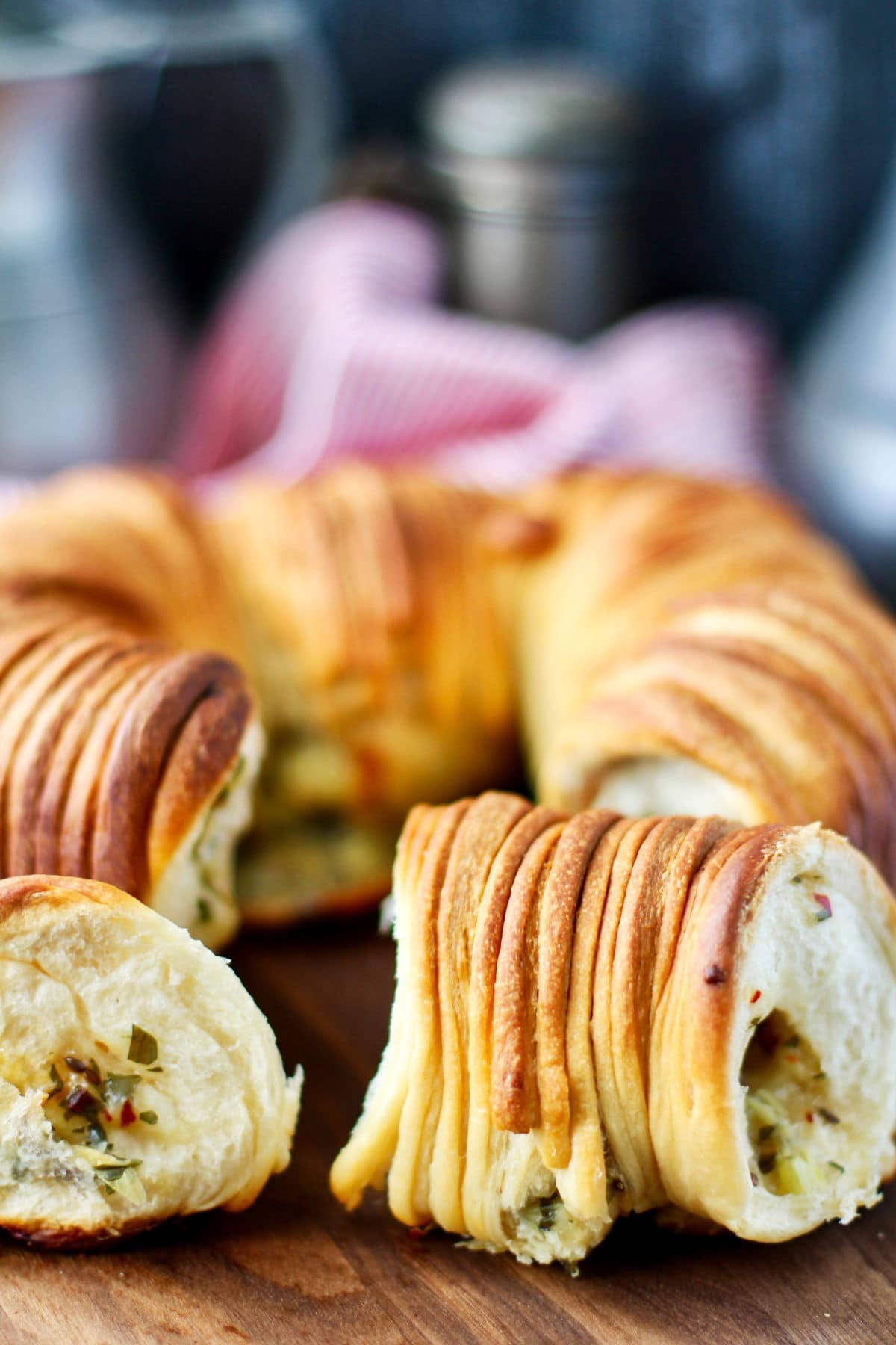 Wool Roll Bread with Gruyère Cheese and Herbs in a pan.