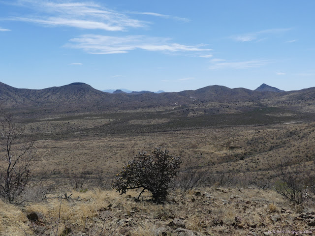 27: point of a peak behind a ridge