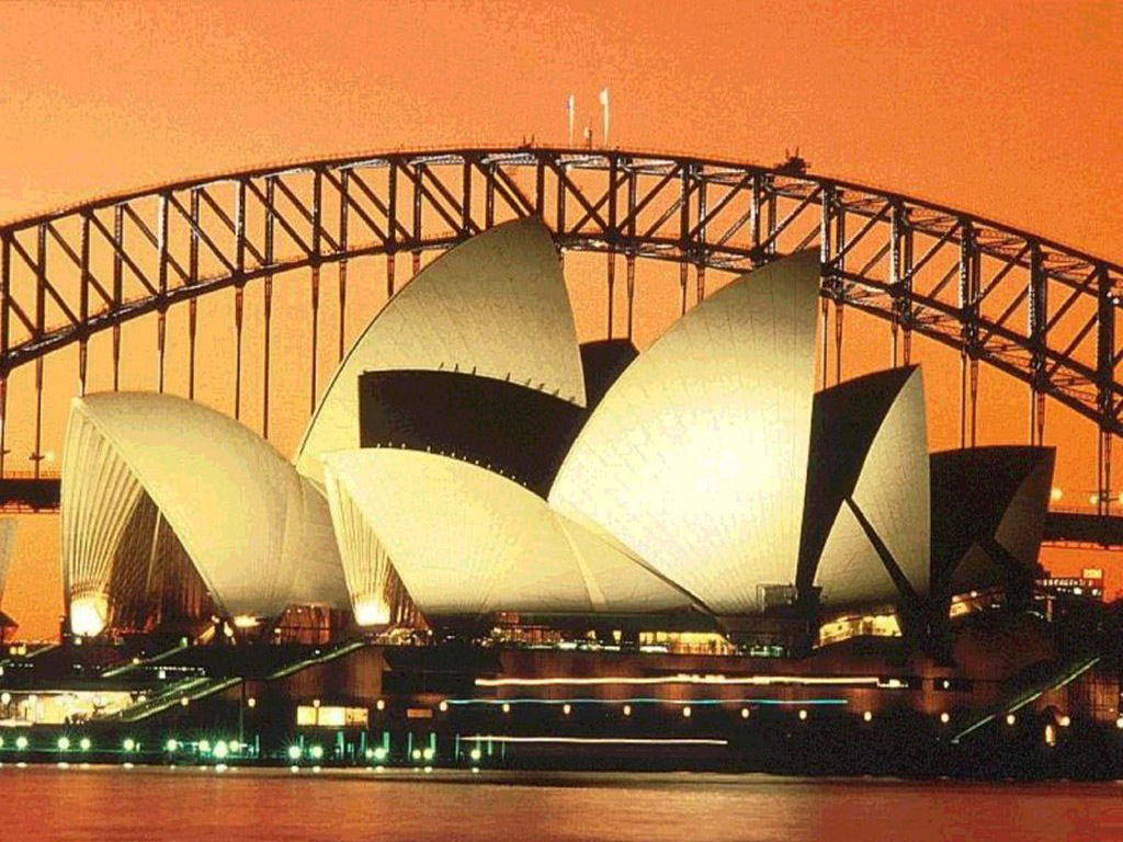 THE OPERA HOUSE AND HARBOUR BRIDGE AT EVENING
