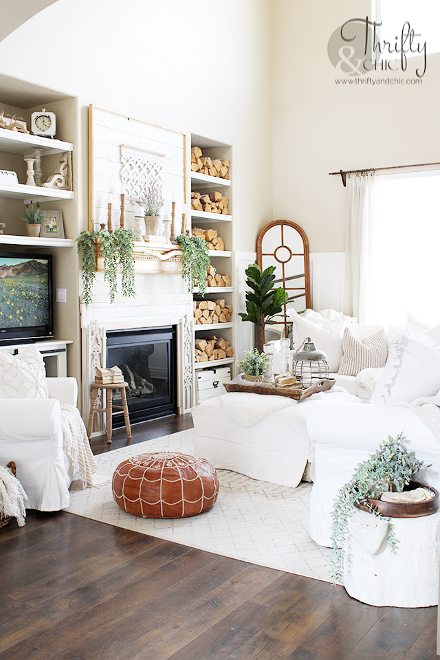 farmhouse style spring living room decor. Spring living room decorating ideas. White and woods living room decor. spring decorating ideas for the home. Two story living room decor. Ikea ektorp couches. Spring mantle decorating ideas. Neutral living room decor