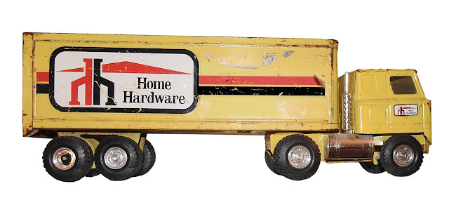 A large tin and metal tractor trailer from Home Hardware, by Ertl.