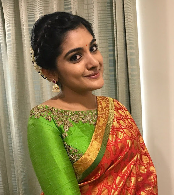 Actress Niveda Thomas In Traditional Orange Saree