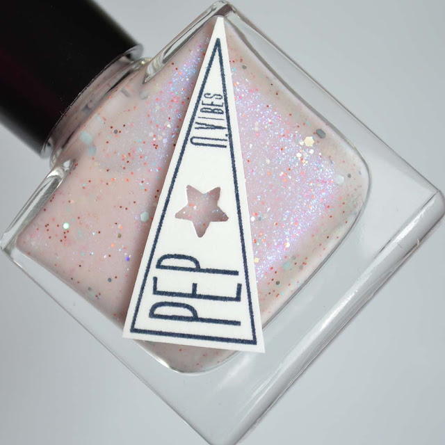 off white nail polish with pink shimmer and glitter