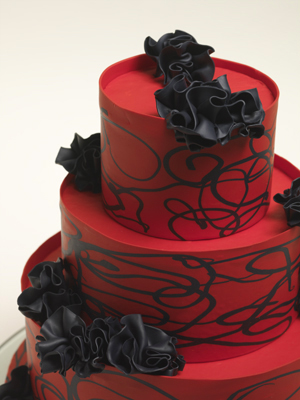 Black and red wedding cake with swirls