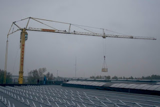 Big Crane Unloading Solar Panels