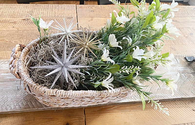 basket centerpiece of stars, flowers and moss