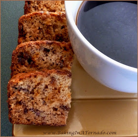 Toffee Butterfinger Banana Bread: Not your average banana bread, butterfinger buts and toffee chips baked into this quick bread adds a whole new layer of flavor. | Recipe developed by www.BakingInATornado.com | #recipe #bananas #bread