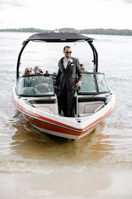 groom entering ceremony on boat