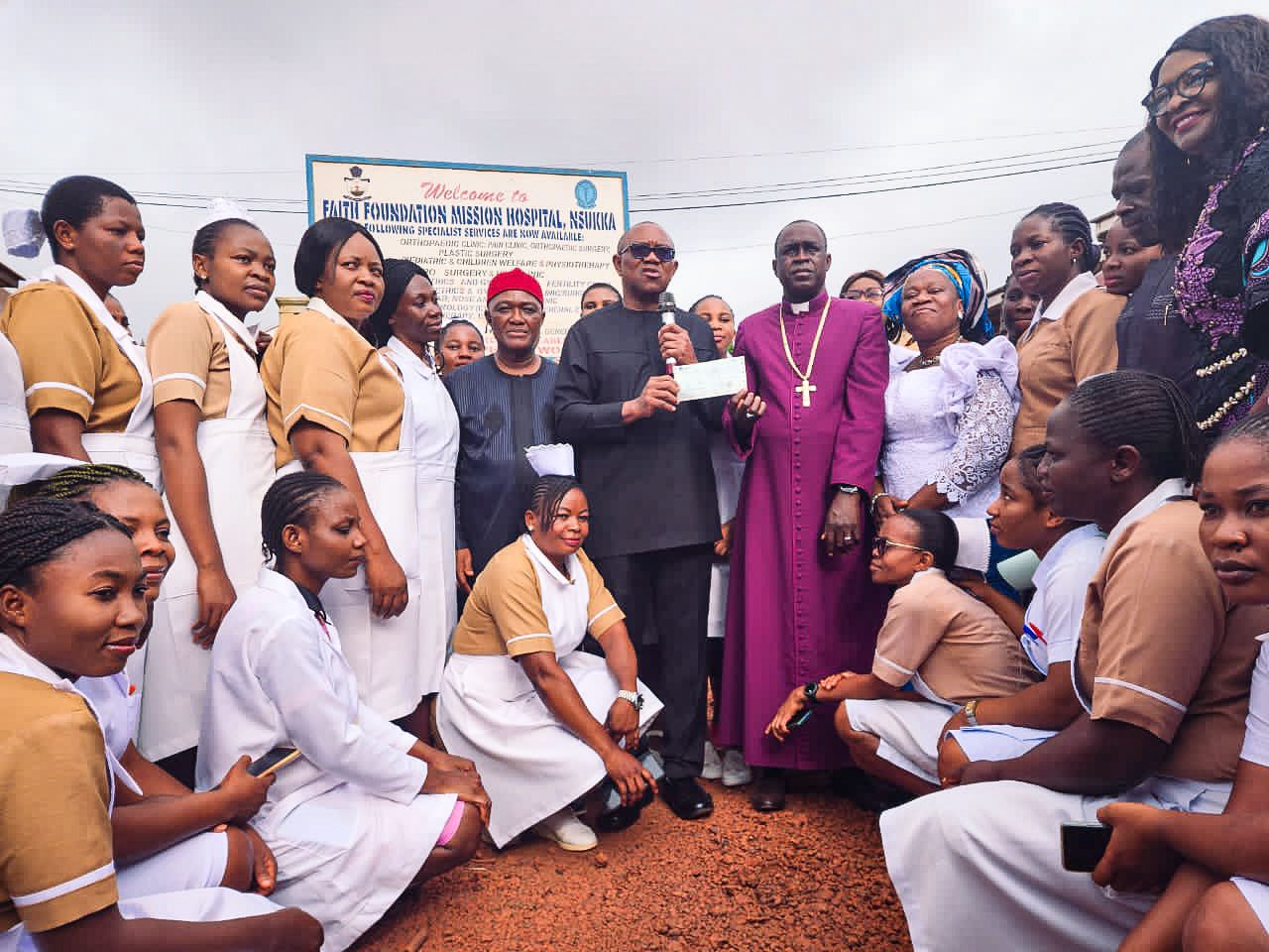 2023 Presidential candidate of the Labour Party (LP), Peter Obi, with the Anglican Bishop of Nsukka, Rt Rev. Aloysius Agbo and health workers at the Faith Foundation Mission Hospital in Nsukka, Enugu State, as he makes a donation of ₦20 million for the commencement of the building of the College of Nursing Sciences