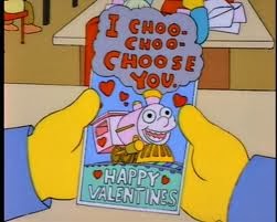 Screenshot from The Simpsons of Ralph Wiggum holding a card that said "I Choo-Choo-Choose You!"