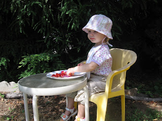 Eating strawberries from the garden