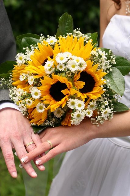 Sunflower wedding bouquet with baby's breath and marigold white flowers