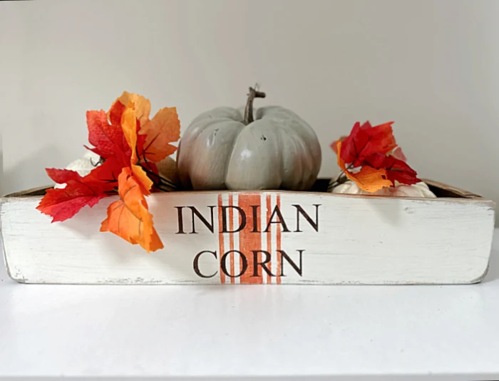 indian corn stenciled crate with pumpkins