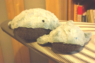 2 whale plushies sat next to each other