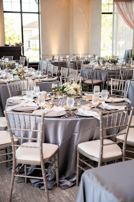 reception setup with silver chavari chairs and silver linen