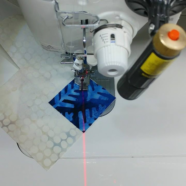 Using a laser to sew stitch and flip corners